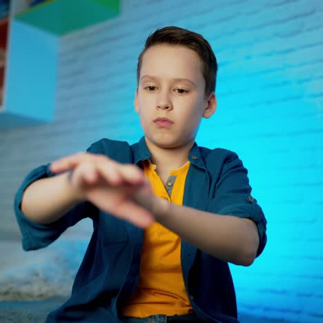 hand sanitizer. boy using hand sanitizer alcohol spray. measures to prevent the spread of the covid-19 virus.