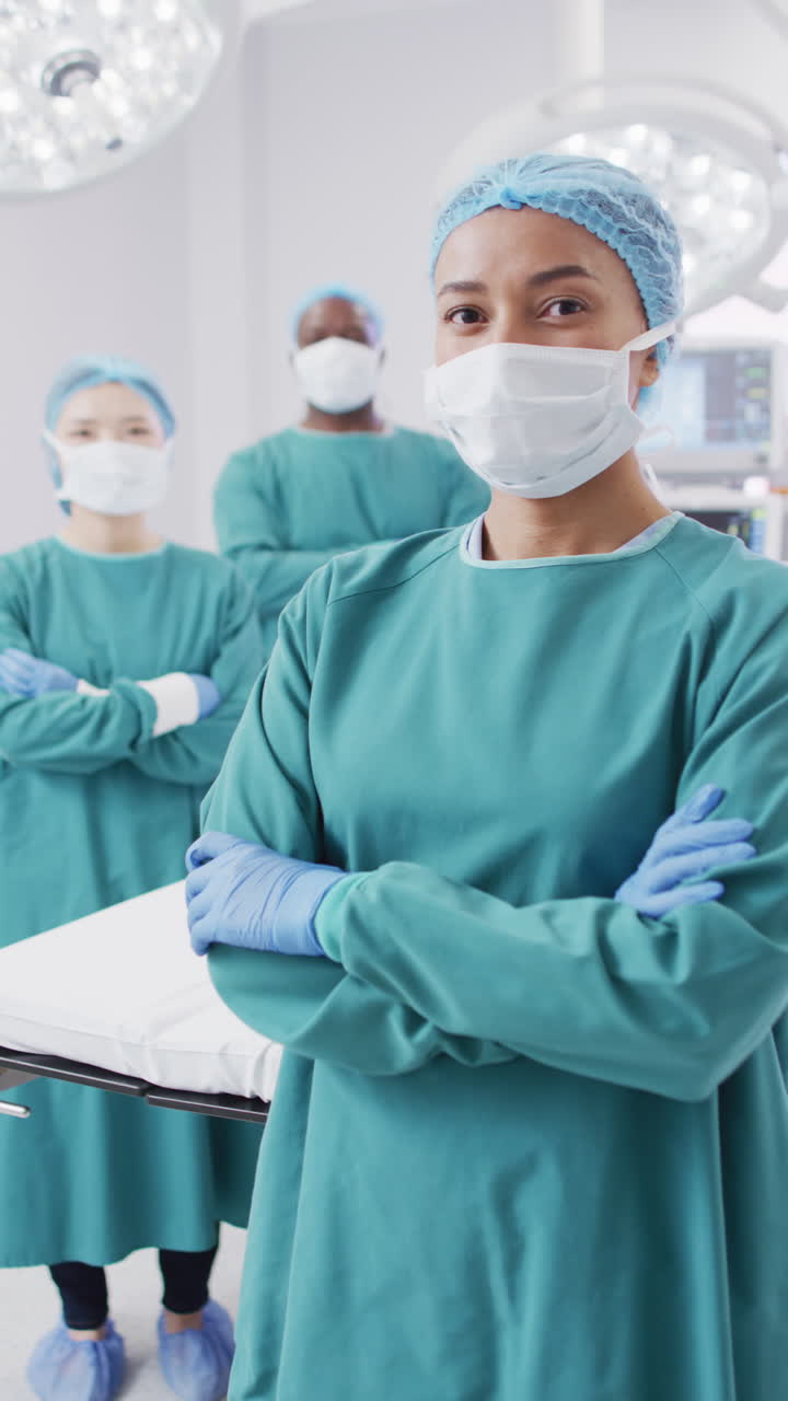 Vertical video of portrait of diverse surgeons with face masks