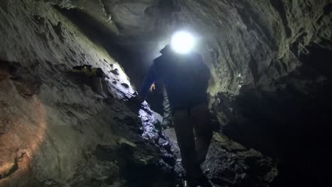 cavers moving in open passage