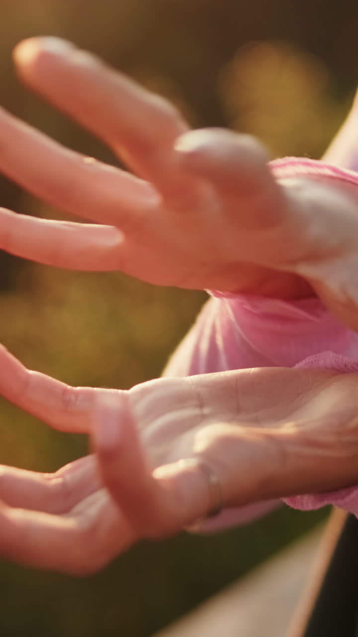 Woman's Hands in Golden Sunlight