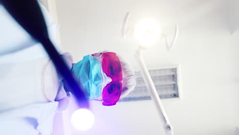 a dentist wearing a surgical mask and protective eyewear