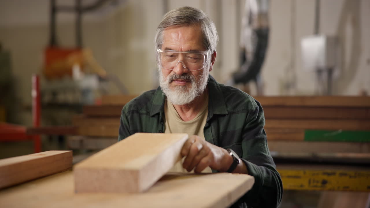 Carpenter inspecting wood