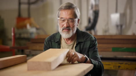 carpenter inspecting wood