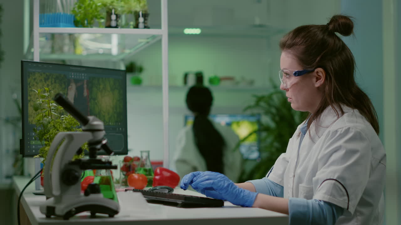 Chemist researcher analyzing test sample putting under microscope