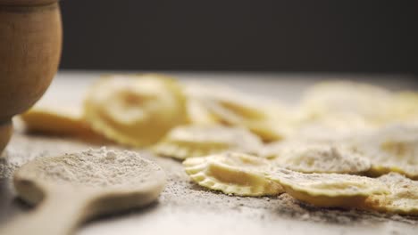 cooking italian ravioli on wooden table.