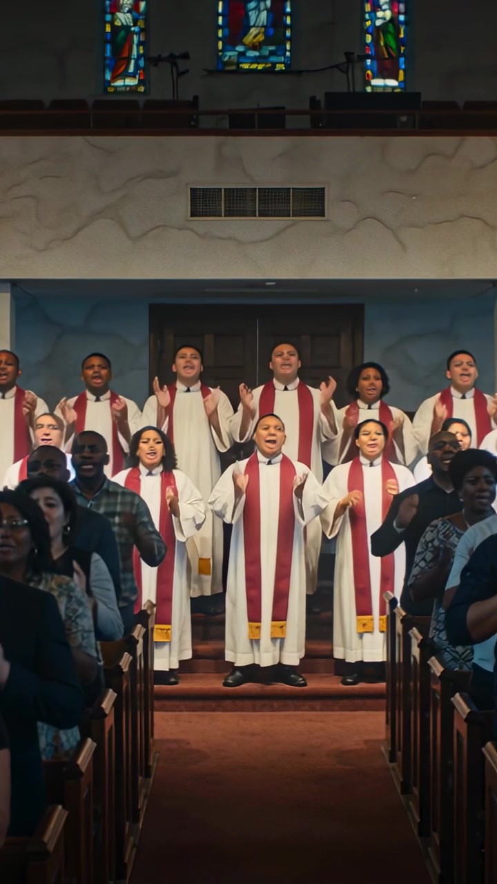 Vertical video: Reacting to music, choir clapping and raising hands in church wearing red stoles