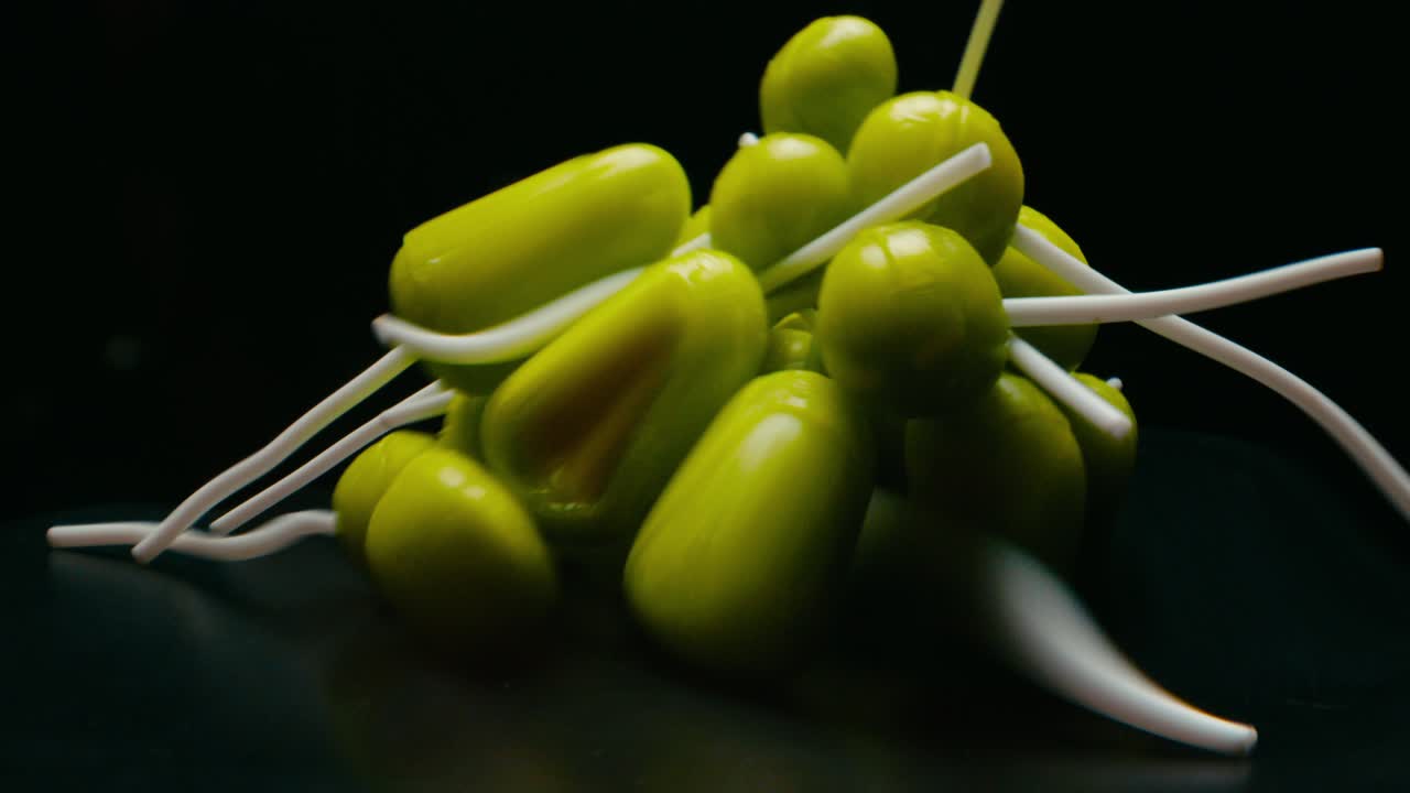 Green lollypop candies rotating. Broll detail shot. Blur glitch effect.