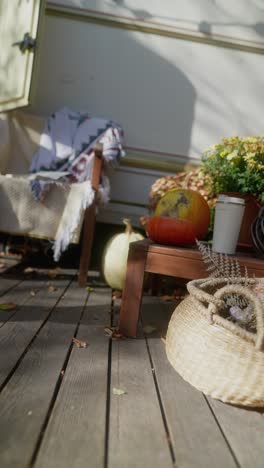 autumn patio decor on a wooden deck