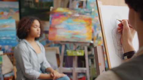 artist drawing a portrait in an art studio