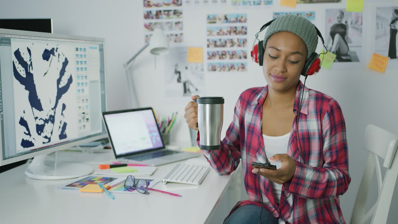 Trendy worker relaxing at workplace