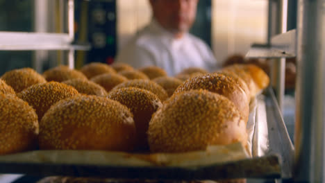 chef placing baked buns in the rack 4k