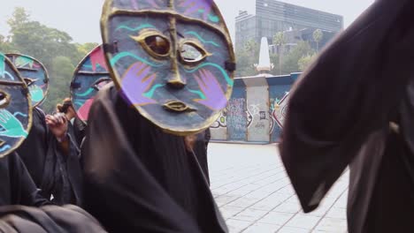 shot of people dressed as characters inspired by the work of leonora carrington during their participation in the day of the dead parade in mexico city