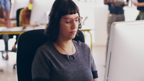 A-serious-and-young-woman-designer-sitting