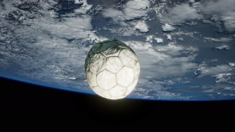 old soccer ball in space on earth orbit