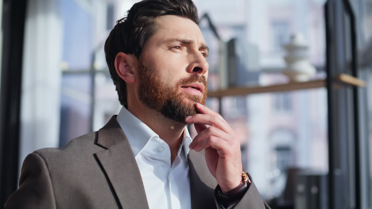 Pensive leader pondering business standing office window looking outside closeup