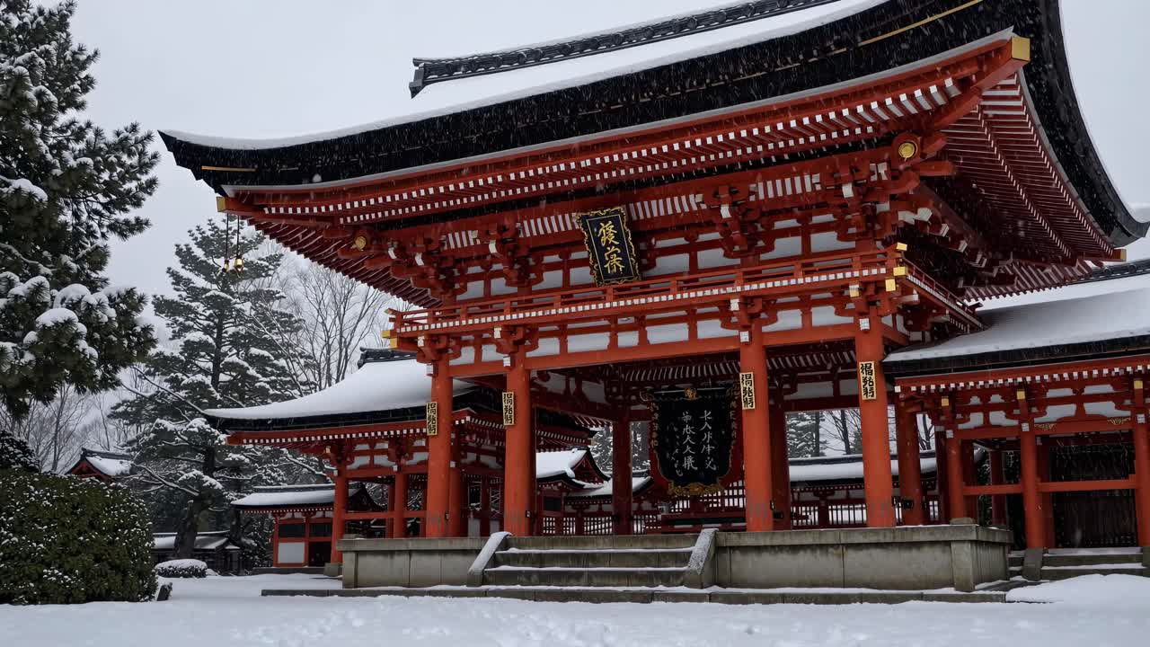 Low-angle video shot of a traditional Japanese temple in winter, showcasing red architecture