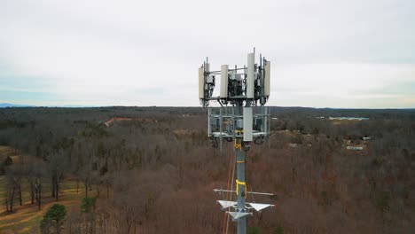 aerial shot revealing cell phone tower in forest