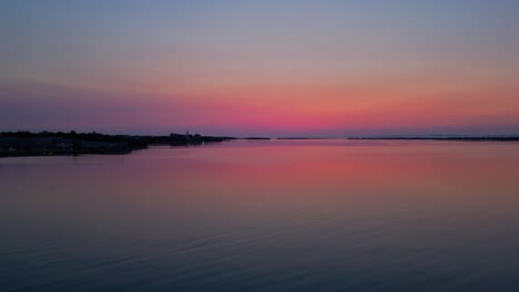 aerial low angle by lake during a red glow sunrise morning