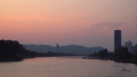 sunset wakeboarding in city river