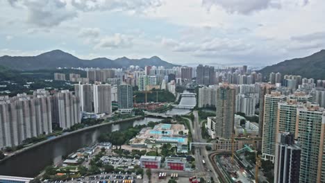 tuen mun from above, aerial view on the river and buildings, hong kong