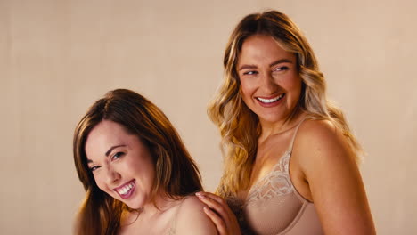 Studio-Shot-Of-Two-Female-Friends-In-Underwear-Promoting-Body-Positivity-Smiling-And-Laughing