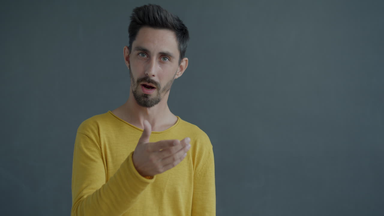 Man Pointing and Talking