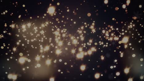animación de copos de nieve y manchas amarillas brillantes sobre fondo negro