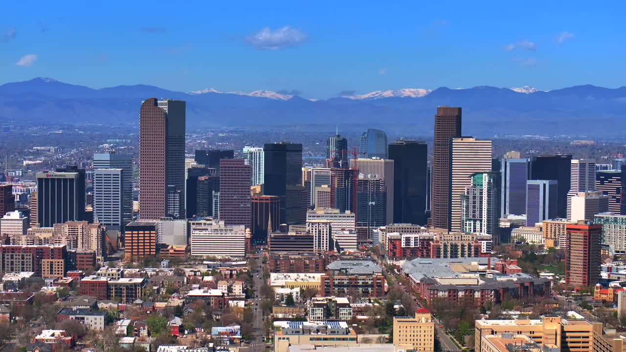 Indian Peaks City Park Lodo Downtown Denver Cityscape Landscape Colorado aerial drone view tall skyscraper buildings city living apartments spring summer front range mountains parallax right circle