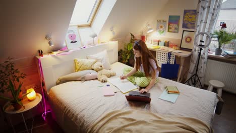 teenage girl studying at home