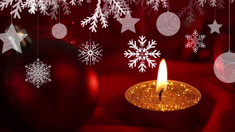 christmas hanging decorations against close up view of red christmas bauble and burning lamp