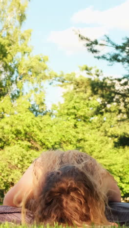 woman meditating in a park