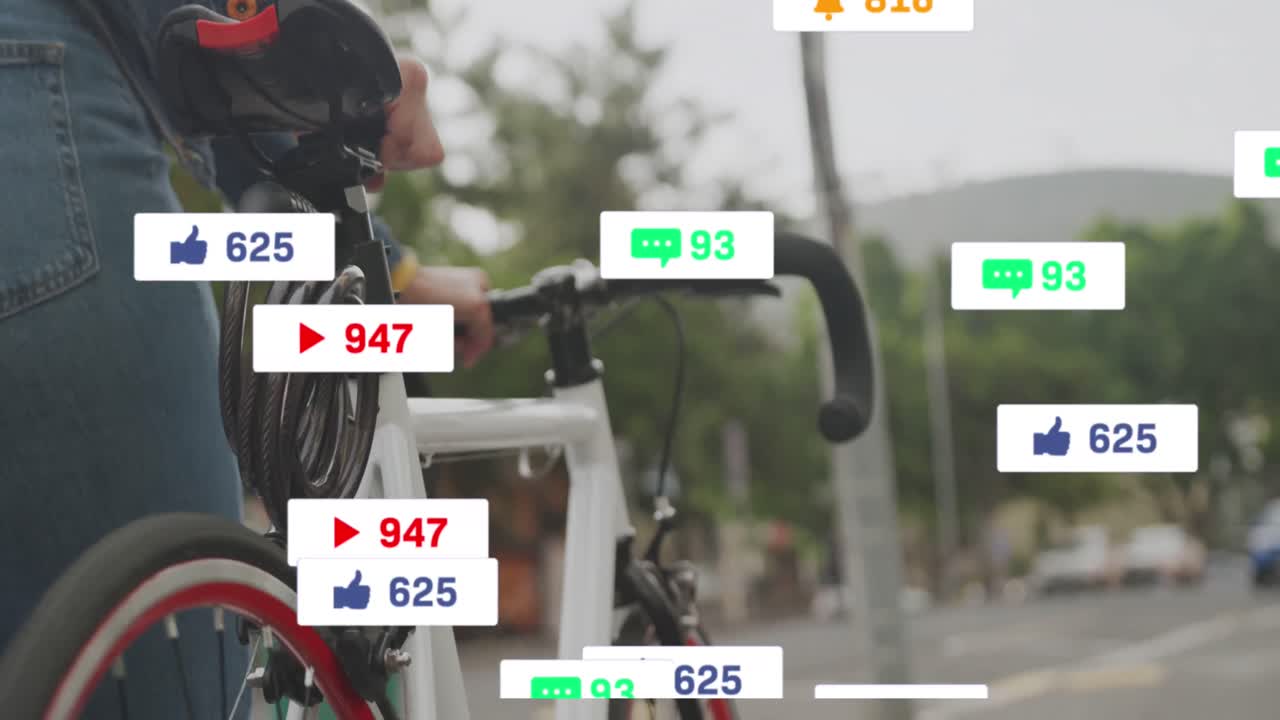 Animation of social media icons over mid section of a man with bicycle walking on the street
