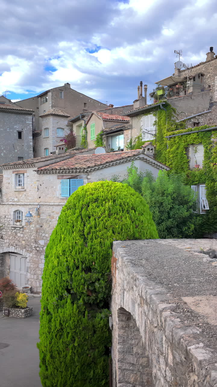 View of the buildings on the streets of the city in Saint Paul de Vence, France. Vertical