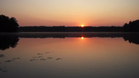sunrise over peaceful lake