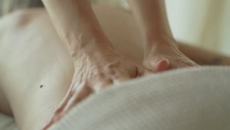 relaxing back massage therapy session in a serene spa setting, close-up shot