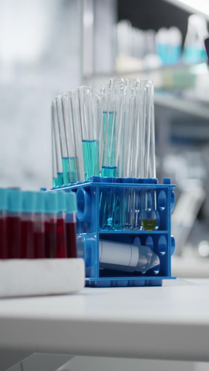 Vertical video Close up of test tube racks on workbench in sterile empty hospital laboratory