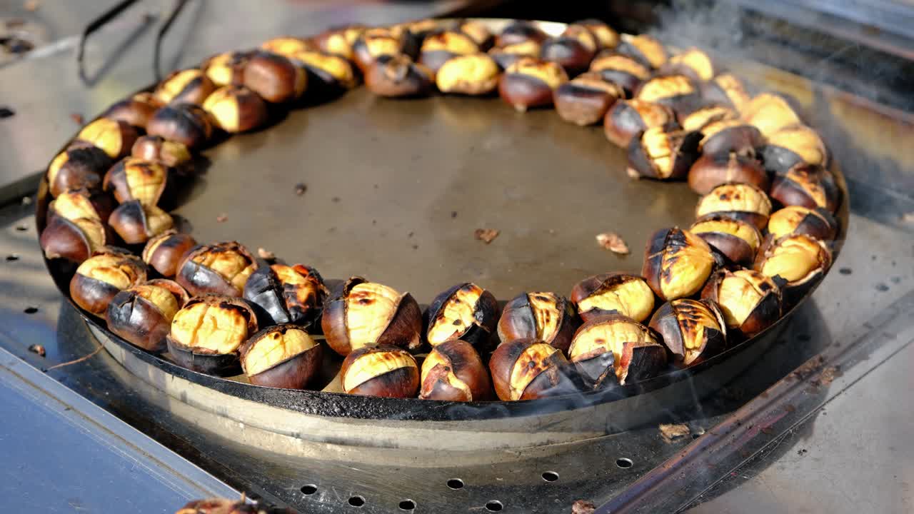 Close up of fresh, hot, grilled chestnuts. Roasted Chestnuts. Traditional street food of Istanbul.