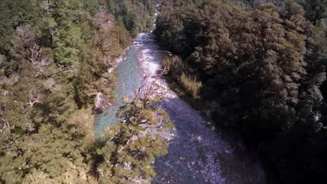 drone filming over the mountain river on bright summer day