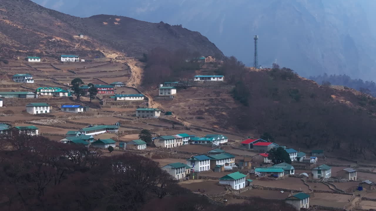 Drone shot of Phortse Village at Everest base camp route, showing serene landscape, Nepali architecture, and peaceful mountain lifestyle of Asian community housings