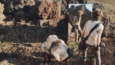 female survivor pushing cart and looking in mirror in dystopian world