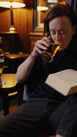 relaxing in a cozy pub with beer and books