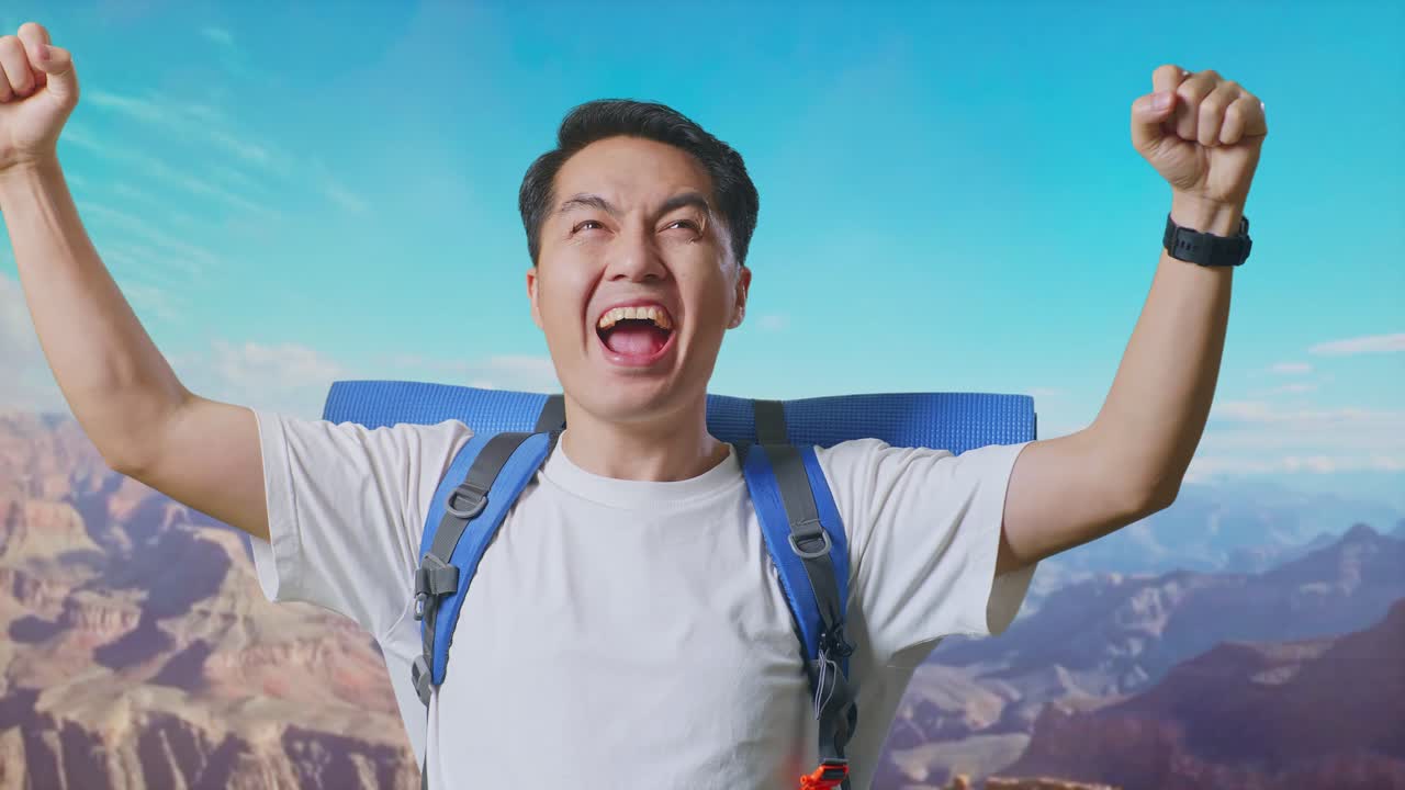 Close Up Of Asian Male Hiker With Mountaineering Backpack Screaming Goal Celebrating The Success While Traveling At The Top Of Mountain
