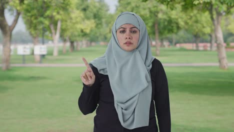 angry muslim woman asking to stop in park