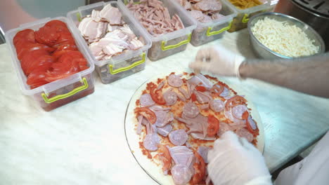 Food ingredients for pizza on table close up. Making a pizza