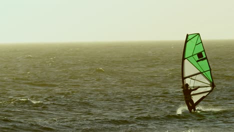 male surfer windsurfing in the beach 4k