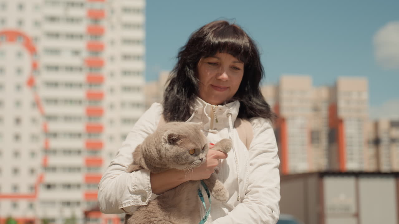 Lady Hugs Cat, Woman Tenderly Cradles Her Tranquil Pet Outside, Lady Lovingly Embraces Her Peaceful Cat On Balcony, Graceful Woman Gently Hugs Her Serene Feline During Quiet Balcony Moments