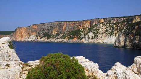 pristine blue water and rocky cliffs of alaties beach in erisos, cephalonia island, greece