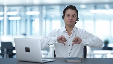 Disappointed-Indian-call-center-employee-showing-thumbs-down