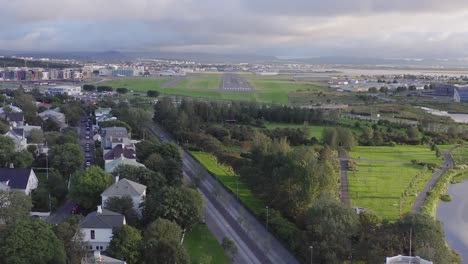 Aerial-view-of-landing-strip-of-Reykjavik-airport,-capital-of-Iceland,-dusk