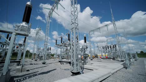 construction of a transformer substation. electrical engineer control wiring electric power on steel tower, electric construction and maintenance services throughout, electric power transmission infrastructure, highest voltage transmission